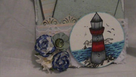 I used the Lighthouse stamp and Copic Colored it. There is alot of texture on the background of the tag and it also has 2 smaller tags that fit in the pocket I created.